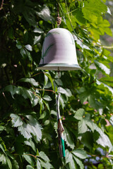 bell as a garden decoration - 550096762