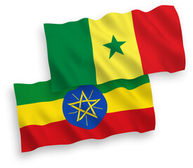 National vector fabric wave flags of Republic of Senegal and Ethiopia isolated on white background. 1 to 2 proportion.