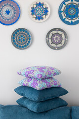Crocheted handmade pillowcases with light blue, violet and grey flower pattern in interior