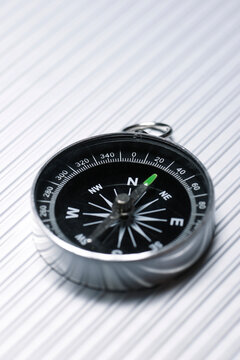 Close-up of navigational compass on table