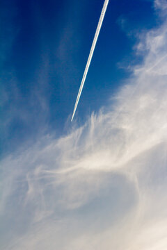 clouds on the background of flying aircraft