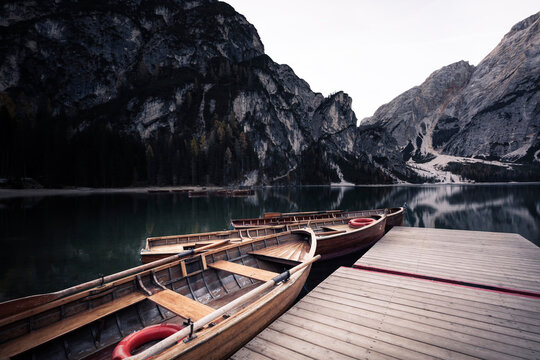 Wooden boats at the alpine mountain lake. Lago di Braies