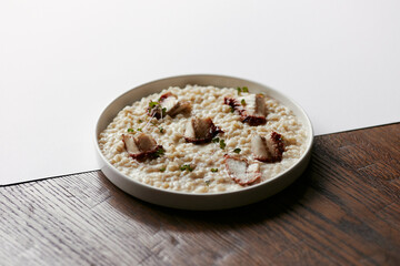 pearl barley porridge with parmesan, eel and tuna shavings