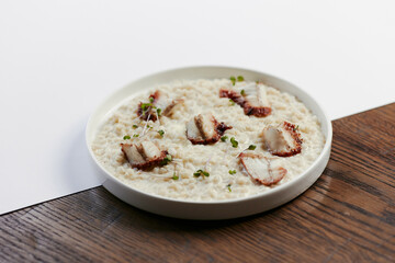 pearl barley porridge with parmesan, eel and tuna shavings