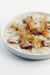 pearl barley porridge with parmesan, eel and tuna shavings