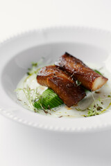 eel baked and laid on avocado