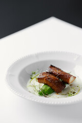 eel baked and laid on avocado