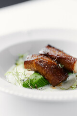 eel baked and laid on avocado