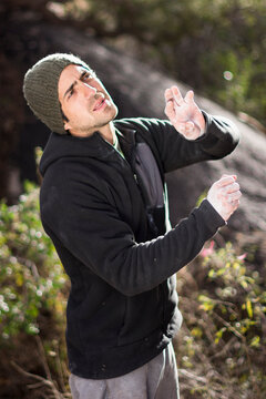 Male climber mimicking the moves of a boulder problem in Pe&Atilde;&plusmn;oles, Chihuahua.