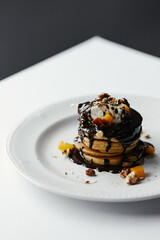 pumpkin pancakes poured with chocolate