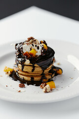 pumpkin pancakes poured with chocolate