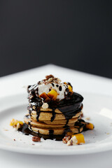 pumpkin pancakes poured with chocolate