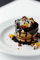 pumpkin pancakes poured with chocolate