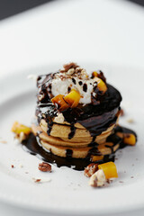 pumpkin pancakes poured with chocolate