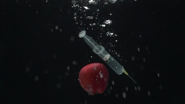 The syringe and apple fall into the water. Big risk. Temptation