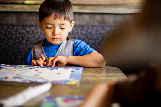 Boy drawing in restaurant