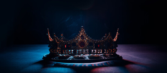 Fabulous golden crown of the king on a dark background. Panoramic view of the abstract fog. Mockup...