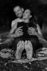 couple celebrates the birth of the baby in the park