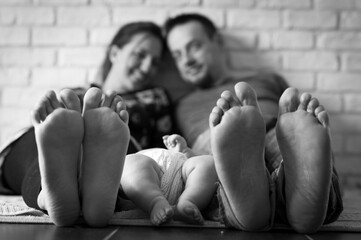 parents feet with child