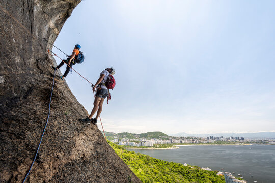 Two men rock climbing, Sugarloaf&Acirc;&nbsp;Mountain, Rio&Acirc;&nbsp;de&Acirc;&nbsp;Janeiro, Brazil