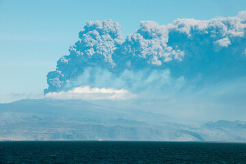 Viewed from Heimaey Island, the ash plume continues to erupt from Eyjafjallajokull Volcano near Skogar, Iceland.