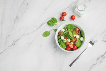 Salad of fresh vegetables and herbs with mozzarella