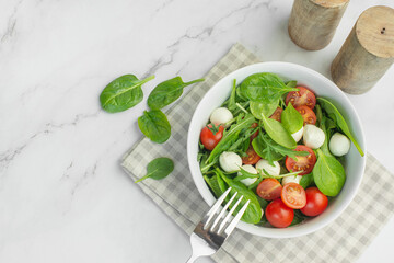 Salad of fresh vegetables and herbs with mozzarella