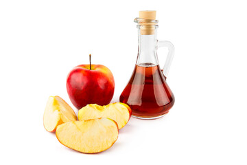 Apples and apple cider vinegar in a jug isolated on a white .