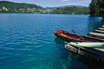 Wooden boat in pier of beautiful Bled Lake, Slovenia.