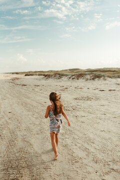 Little Girl Walking on beach in Corpus Christi Texas
