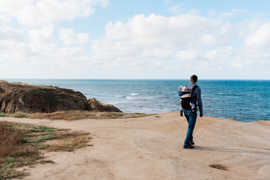 Young Father Hiking With His Baby Son In Southern California.