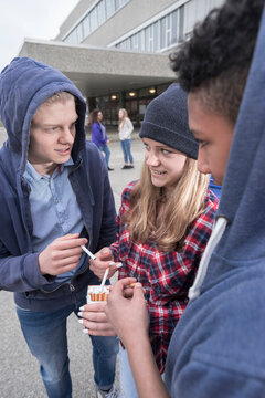 University students smoking cigarettes in campus, Bavaria, Germany