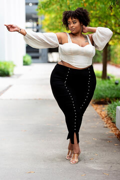 Plus size fashion forward Black woman outside 