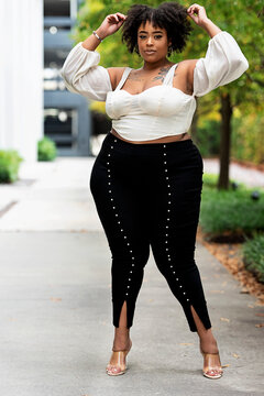 Plus size fashion forward Black woman outside 