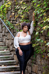 Plus size fashion forward Black woman outside 