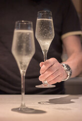hands with champagne glasses