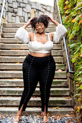 Plus size fashion forward Black woman outside 