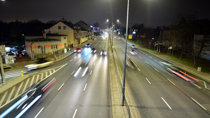 Fototapeta na wymiar Cars move on the night highway. 