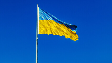 Ukrainian yellow blue flag flutters waving in the wind. National symbol of Ukraine in sky. Freedom concept.

