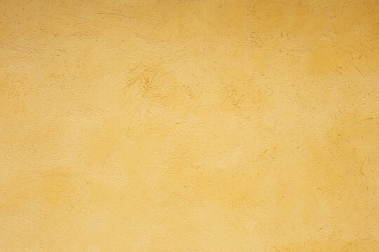 textured gold background. cement wall