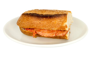 Isolated marinated tenderloin steak sandwich on a plate.