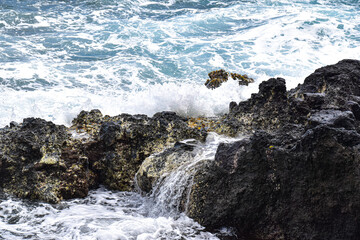 waves crashing on rocks