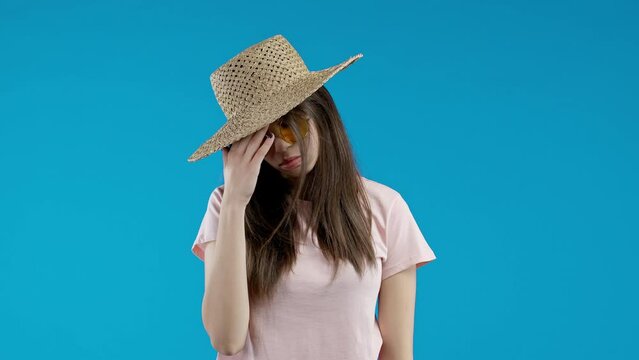 Worried young teen girl doing face-palm gesture, like no, I forgot. Disappointed woman feeling sorrow, regret, drama, failure, problems on blue background.