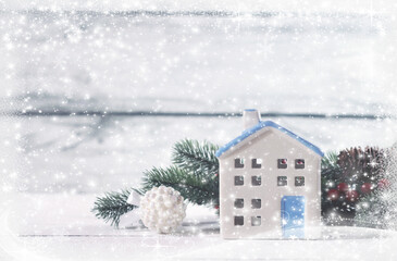 Merry Christmas and Happy New Year greeting card. Cozy background with a decorative candlestick in the shape of a house.