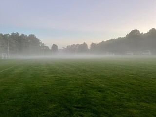 Background of soccer field with fog