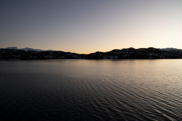 The lake and mountains at nightfall.	
