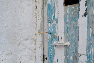 Old, picturesque main front door in mediterranean region house