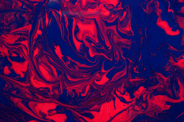 Abstract background from liquid nail polishes,blue and coral tones.