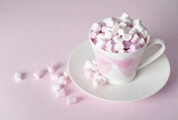 light pink and white marshmallows in a beautiful ceramic cups with pink hearts