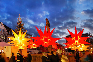 Colorful decorations light up downtown Reutlingen at Christmas time. Maximiliansbrunnen on the...